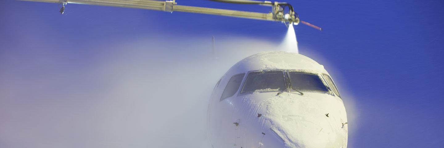 Airplane being de-iced at an airport
