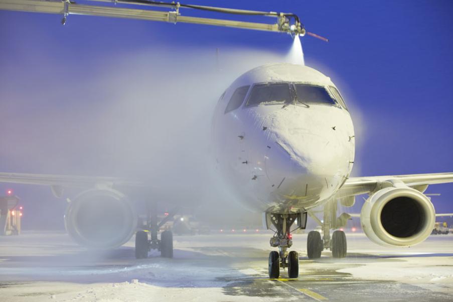 Airplane being de-iced at an airport